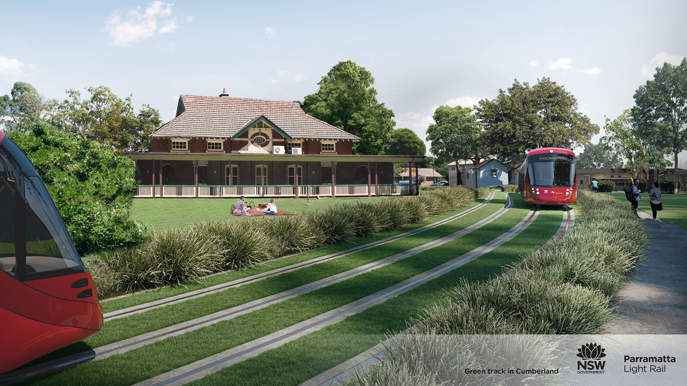 Architects rendering of two trains passing each other in Cumberland on a Green Track where the rails of the track are surrounded on all sides and in the middle with green grass rather than concrete or gravel 