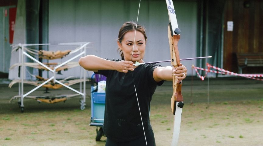 woman holding a bow and arrow