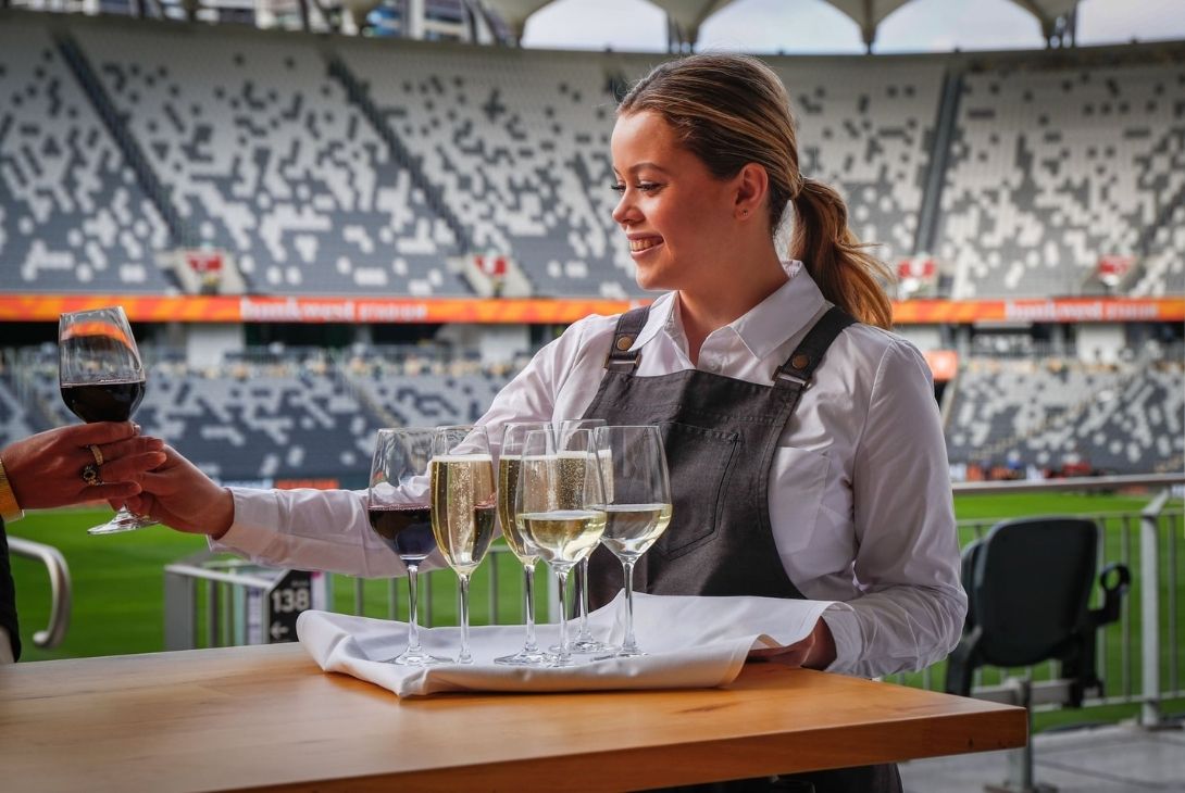 Waitress serving drinks at Bankwest Stadium 