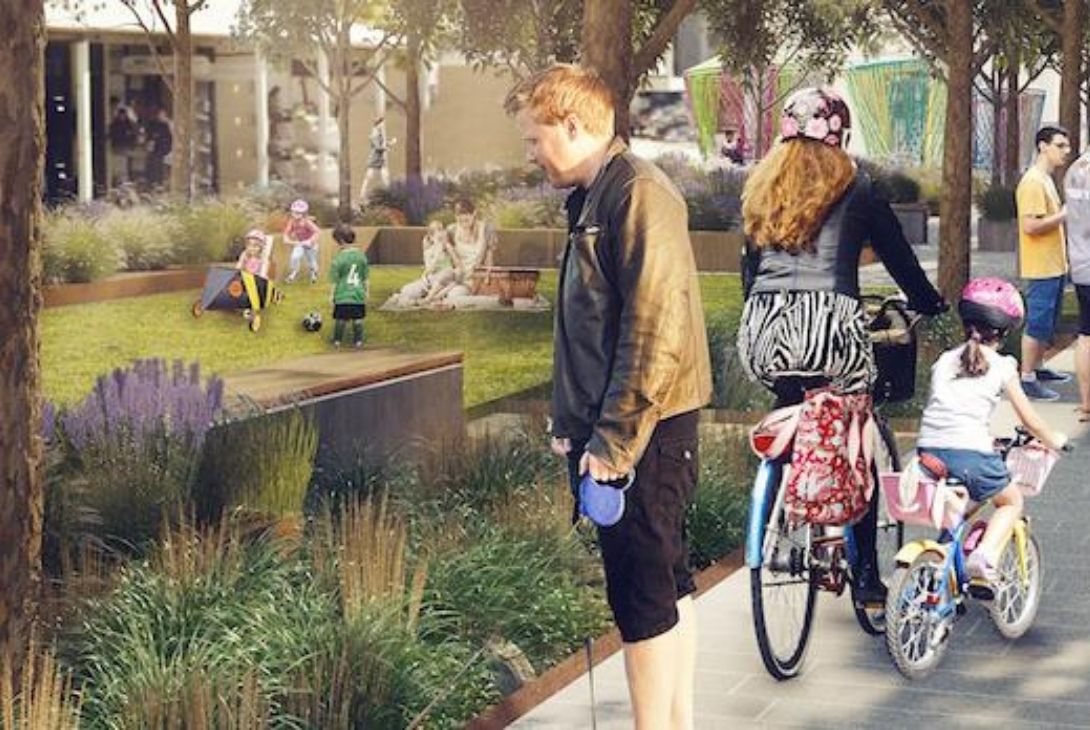 green space with people walking, cycling