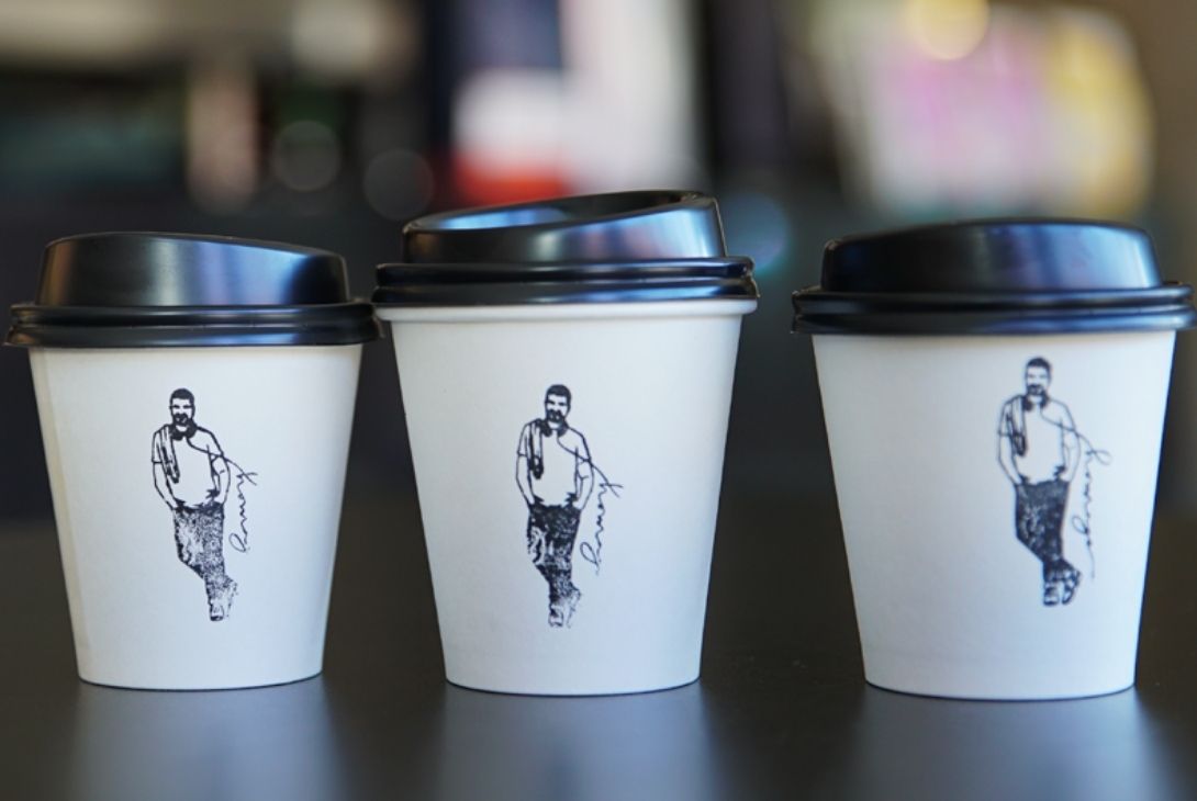 three disposable coffee cups side by side