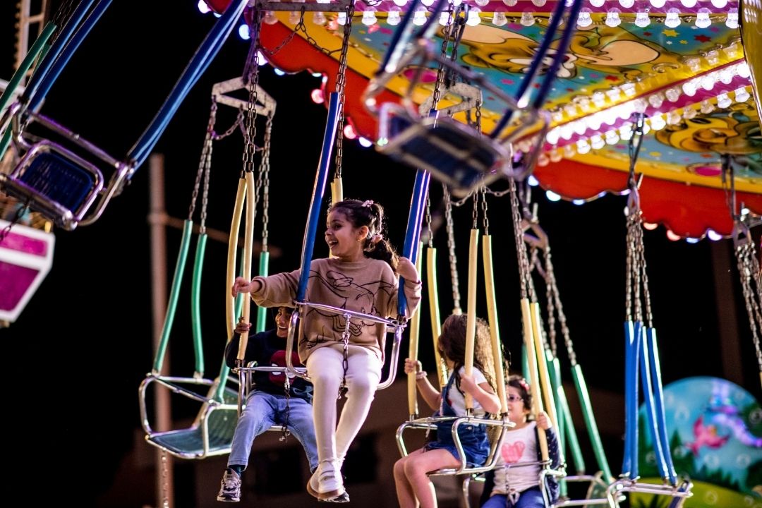 young girl on a carnival ride