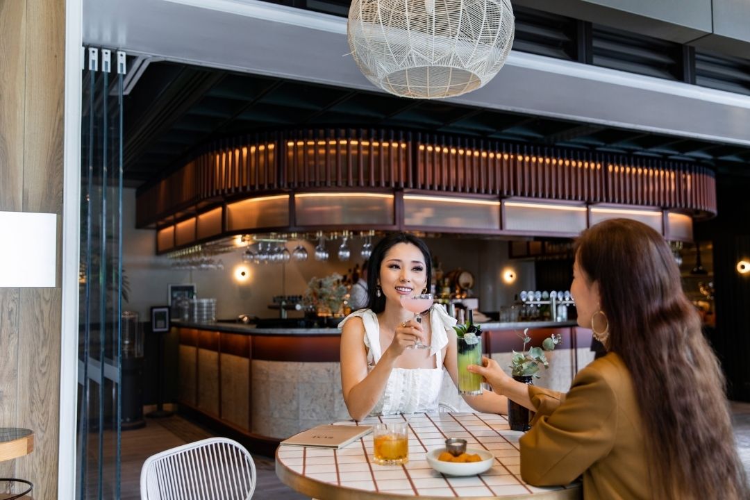 Girl with a friend drinks