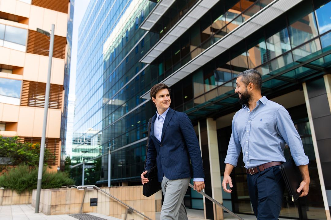 two office workers walking through the justice precinct in parramatta