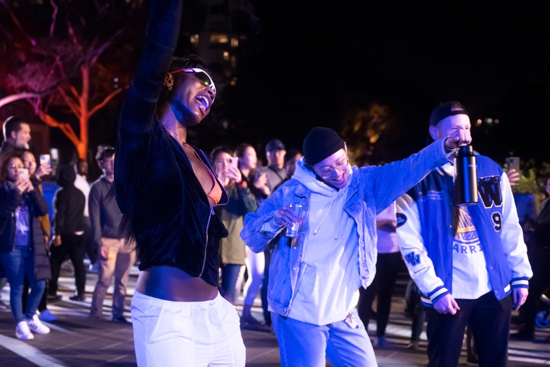 Two people dancing in a crowd