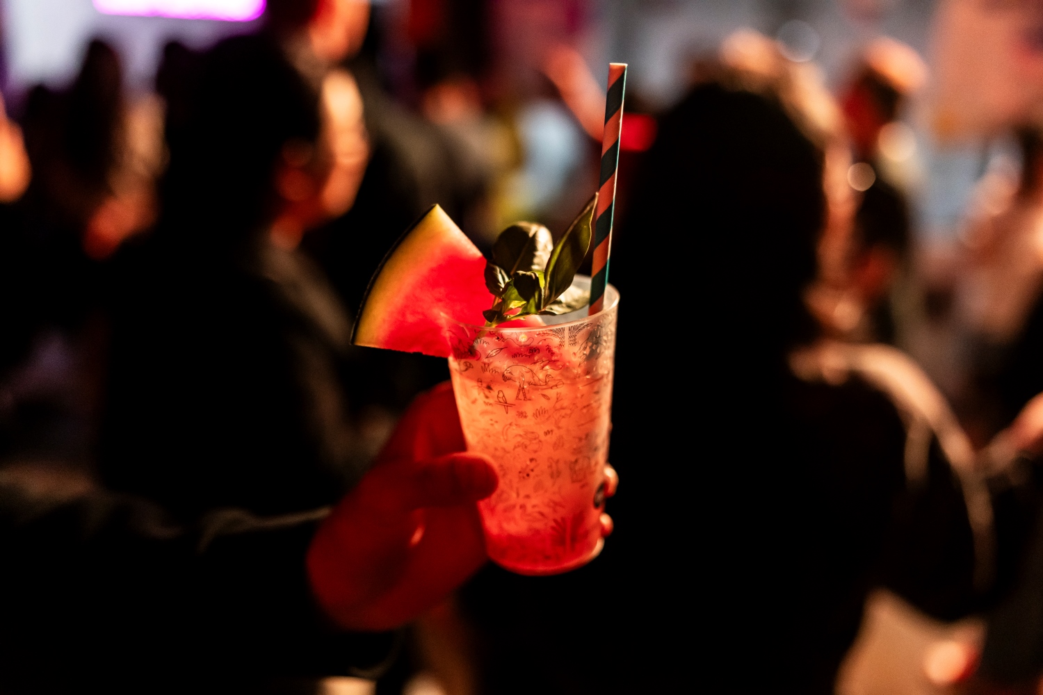 Person holding a cocktail