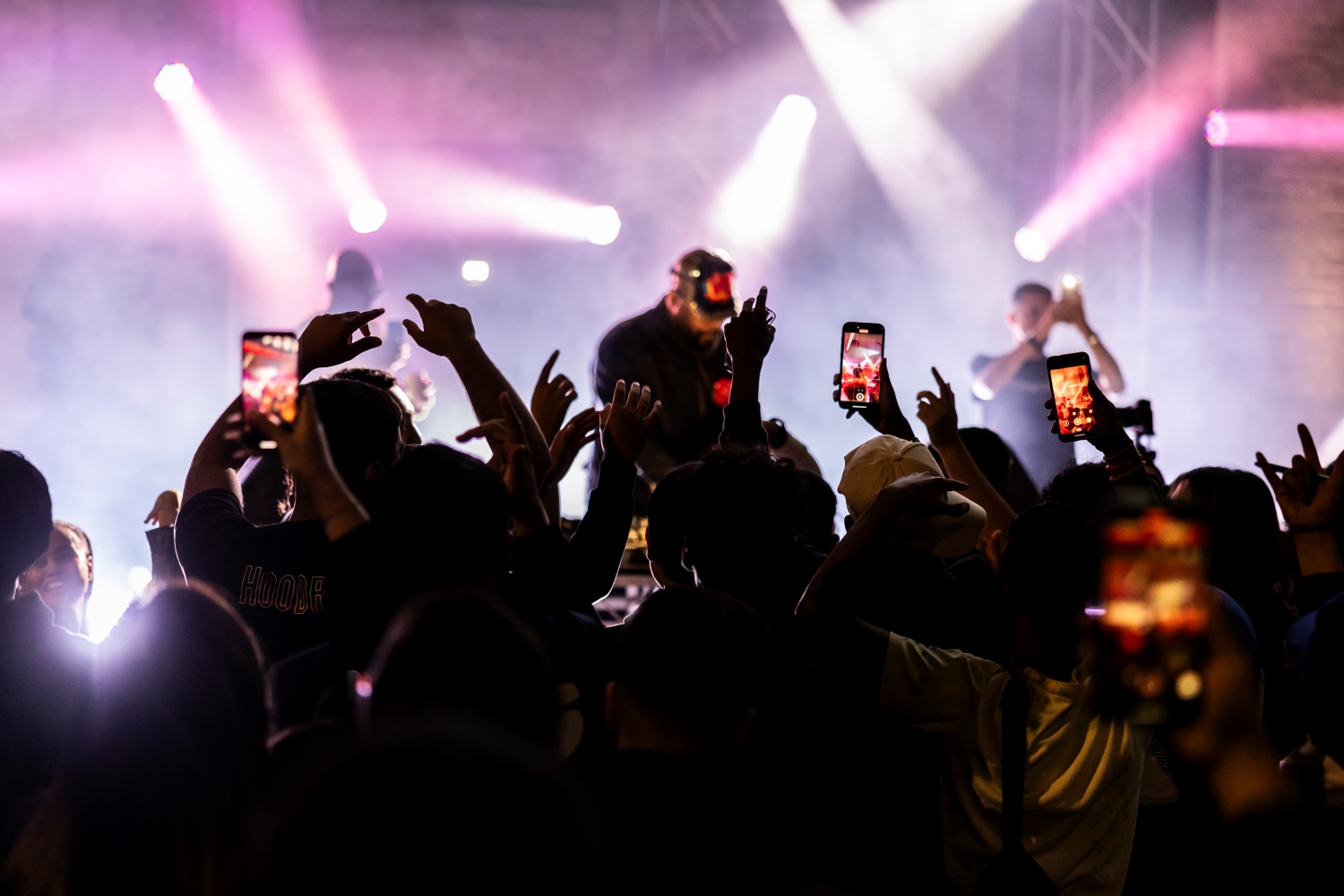 band playing on a stage in front of a big audience