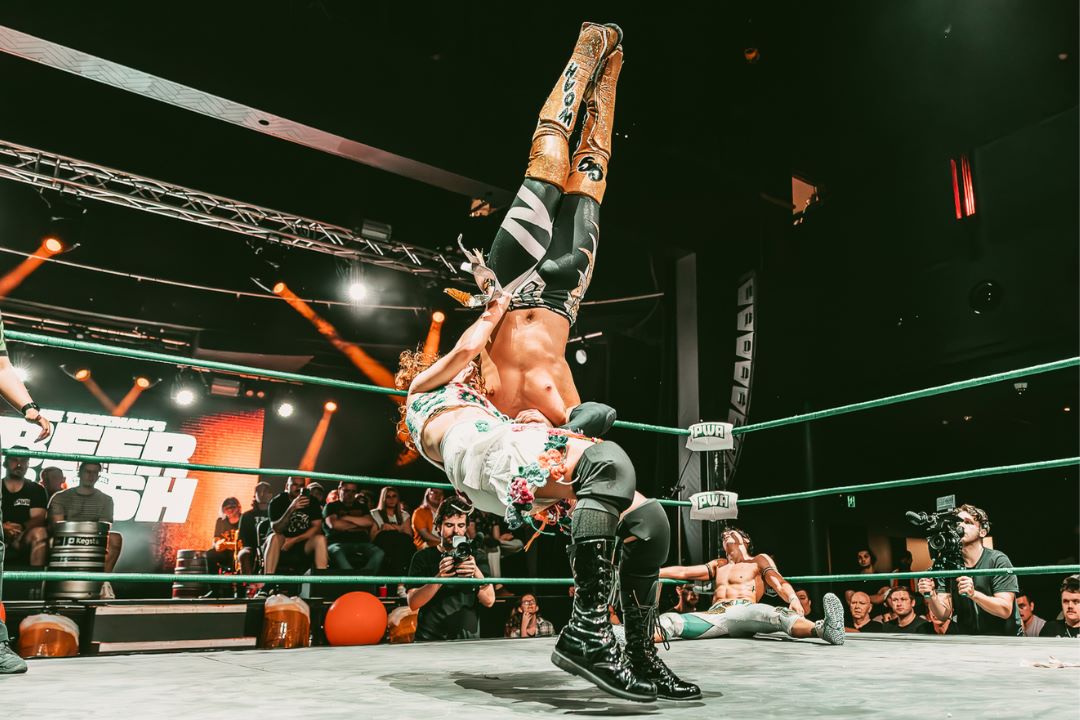 Two men wrestling in a ring