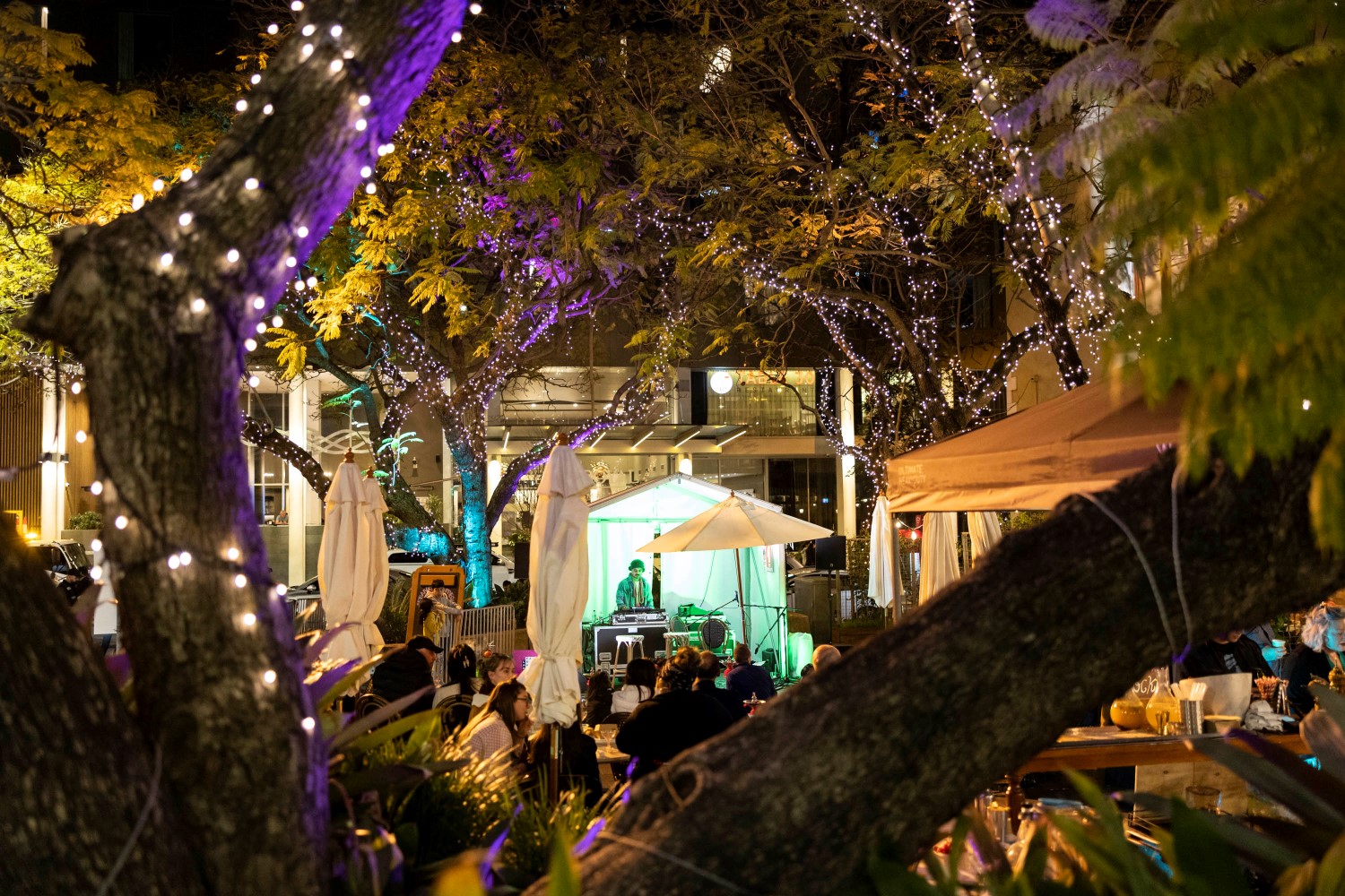 Fair lights and performer at Baba Ghanouj courtyard