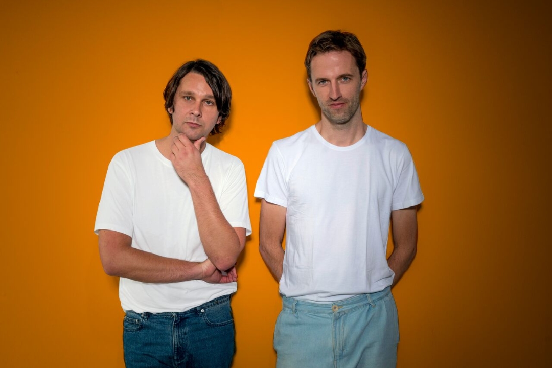 Cut Copy standing next to each other