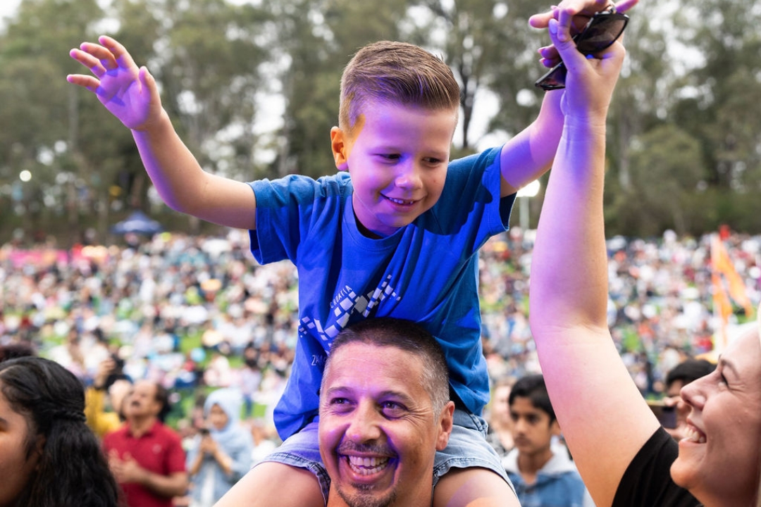 Kid on parents shoulders