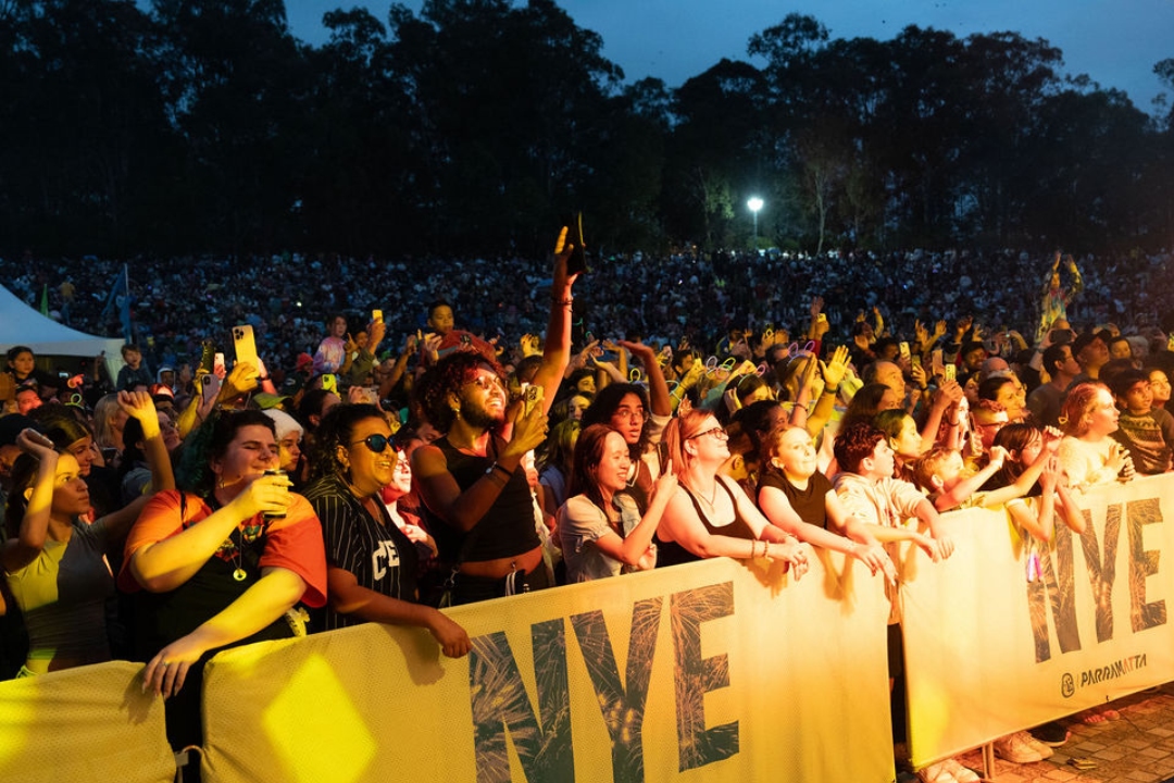 People at the barrier of a NYE concert