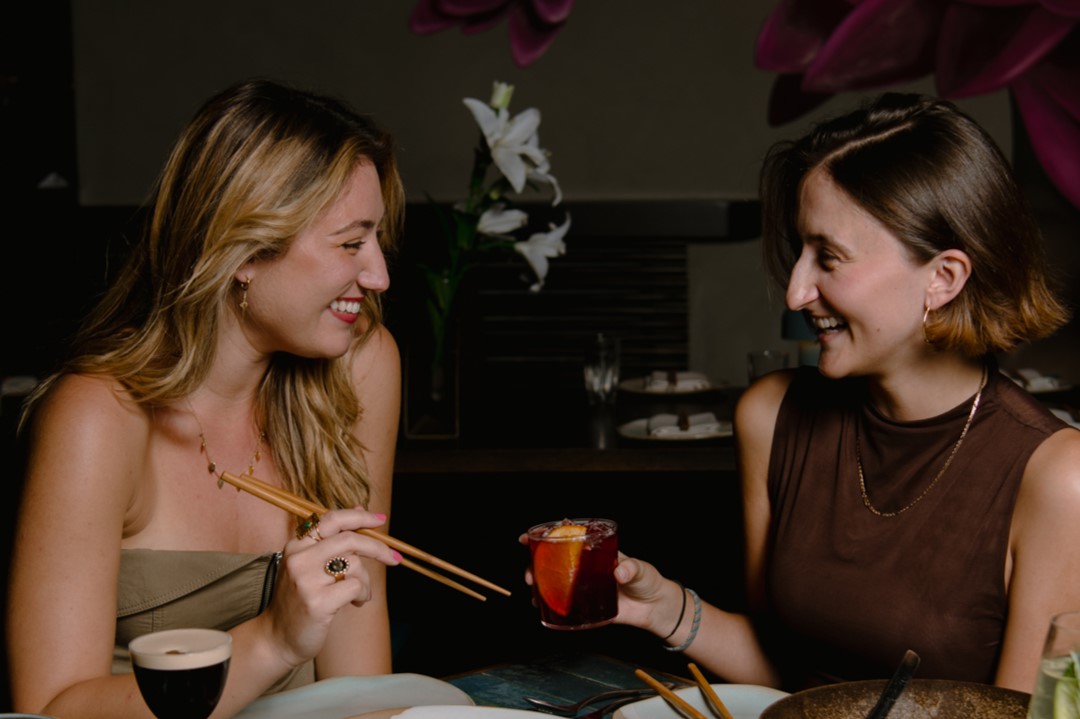 Two girls with chopsticks