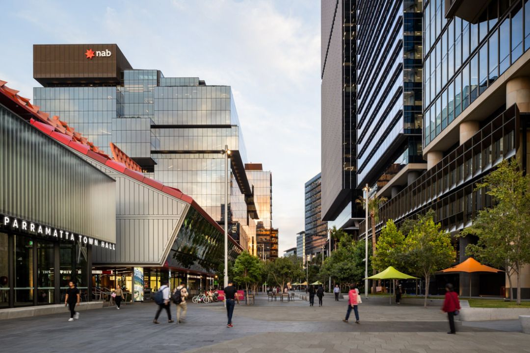 Urban landscape of high rise buildings and people walking between them in a Parramatta Square