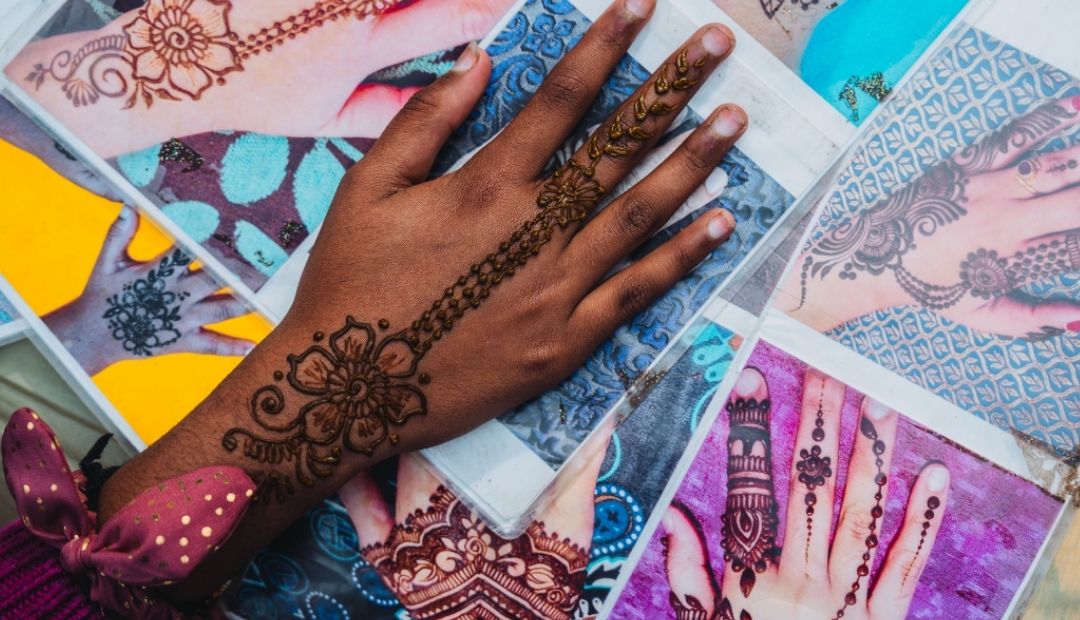 Hand covered in henna tattoo