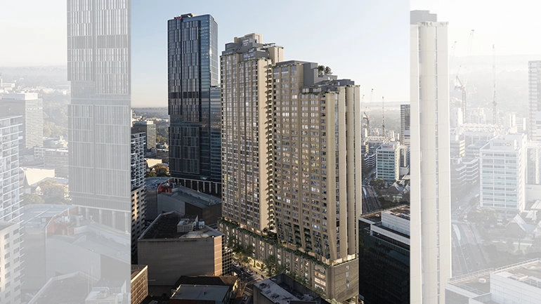 Aerial view of modern skyscrapers in an urban cityscape, featuring a cluster of tall buildings under a clear blue sky.