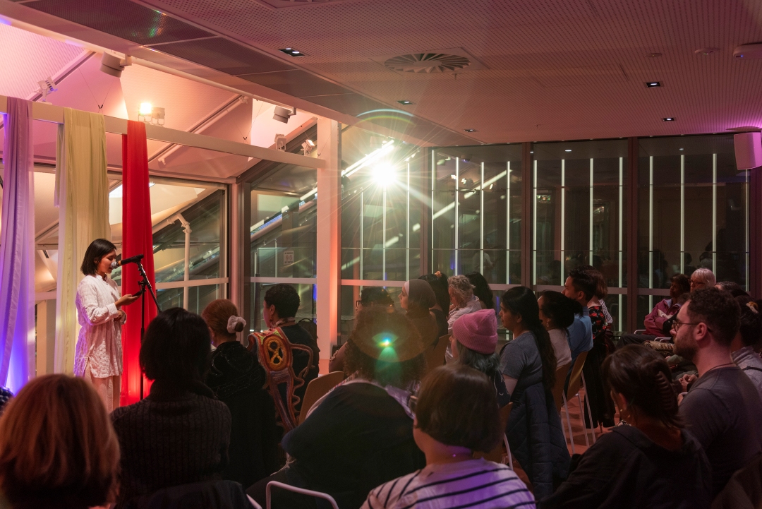 People listening to speaker on The Western Terrace