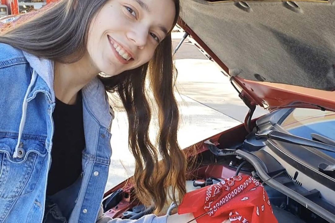 Teen Girl Checking Oil