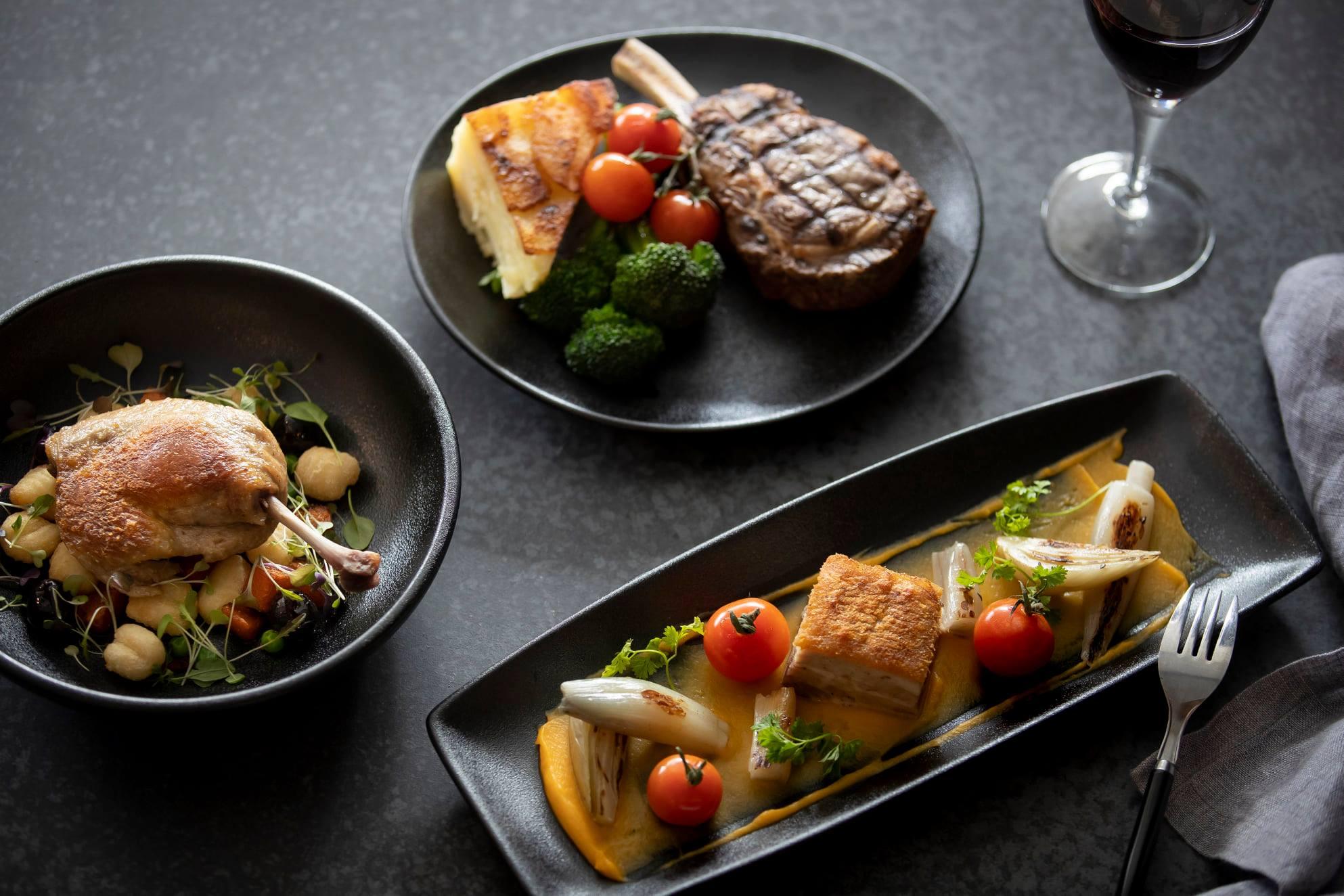 dark plates of food on table