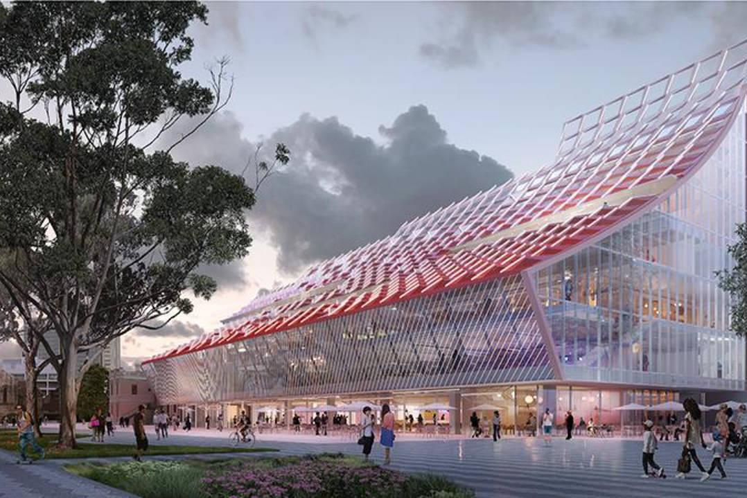 Architects Rendering of the City of Parramatta's new Civic Building located at 5 Parramatta Square. It is dusk and people, workers and patrons are leisurely walking around the public domain in front of the glasshouse building. 