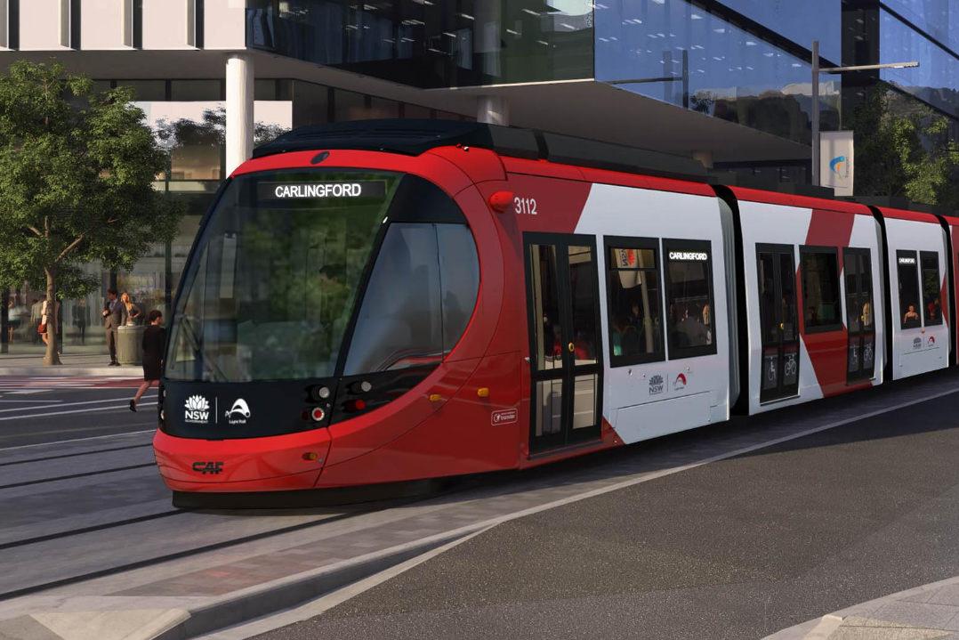 IMAGE OF NEW LIGHT RAIL CARRIAGE PASSING THROUGH INTERSECTION BOUND FOR THE SUBURB OF CARLINGFORD