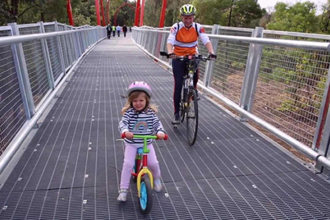 A mother and daughter enjoy the new Subiaco cycle way that bypasses a busy Rydalmere industrial precinct that previously left cyclists with no options but road or sidewalks. 