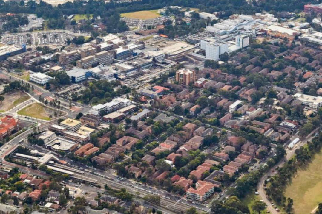 Aerial image of the Westmead precinct including residential and medical, education and research facilities unique to the medicine innovation precinct. 