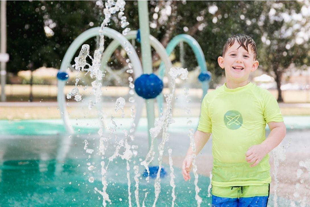 boy at james ruse reserve water playground