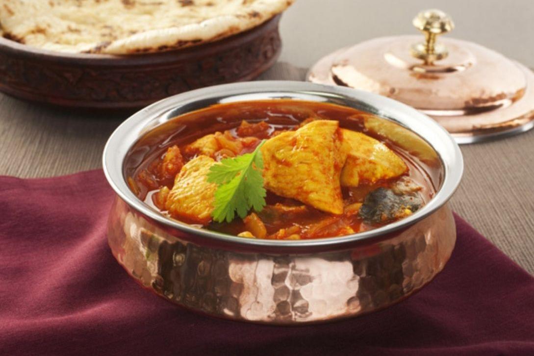 chicken madras curry in a silver dish