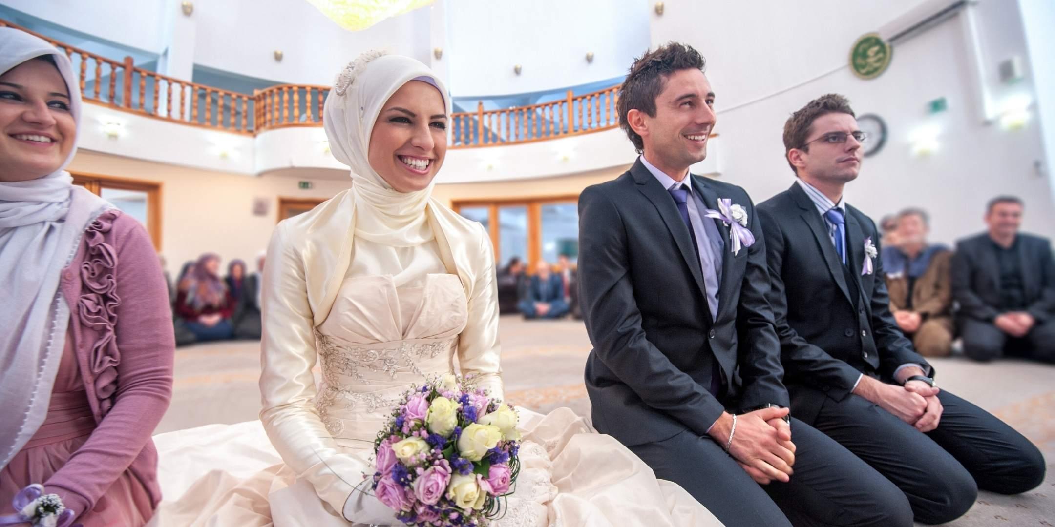 Smiling islamic bride and groom marrying at a mosque