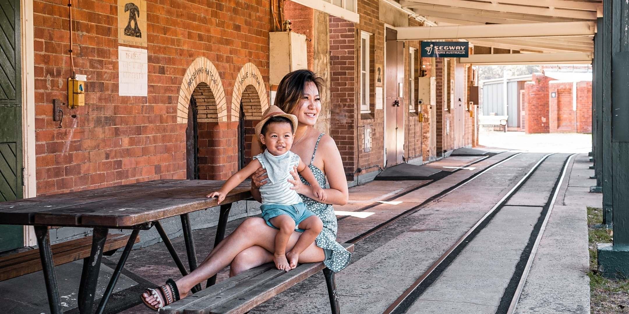 Mum and Baby at rail tracks Newington