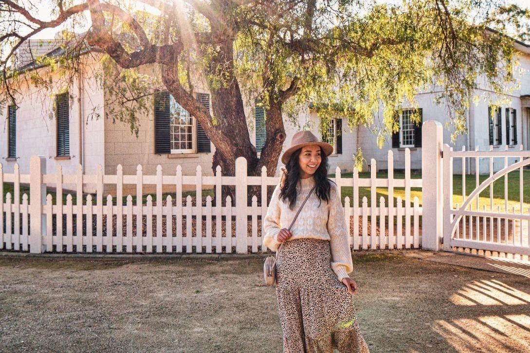 woman standing outside Old Government House