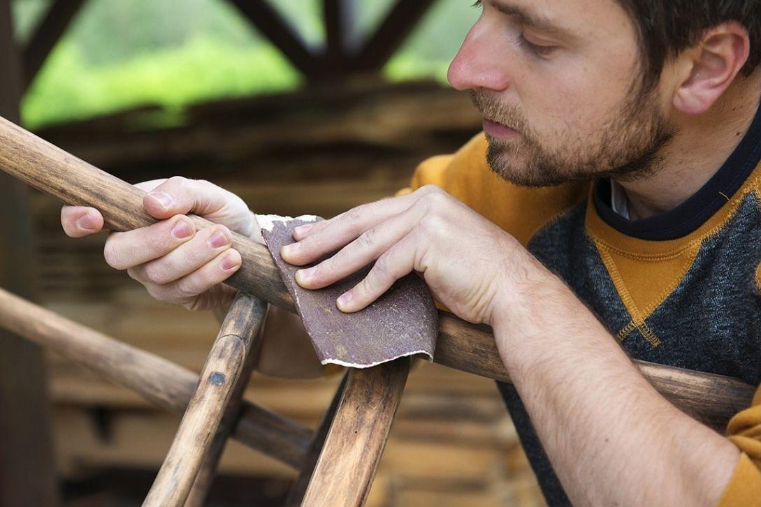 man fixing a chair