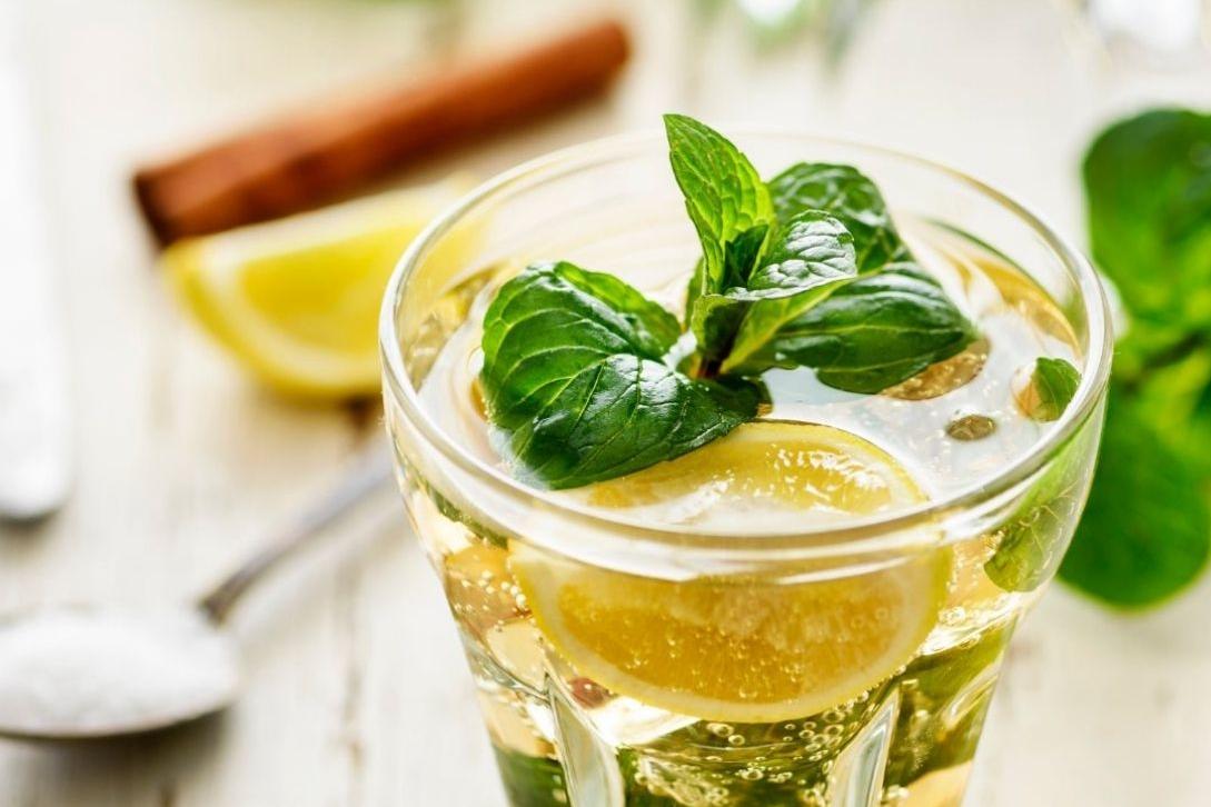 alcohol beverage with mint on top