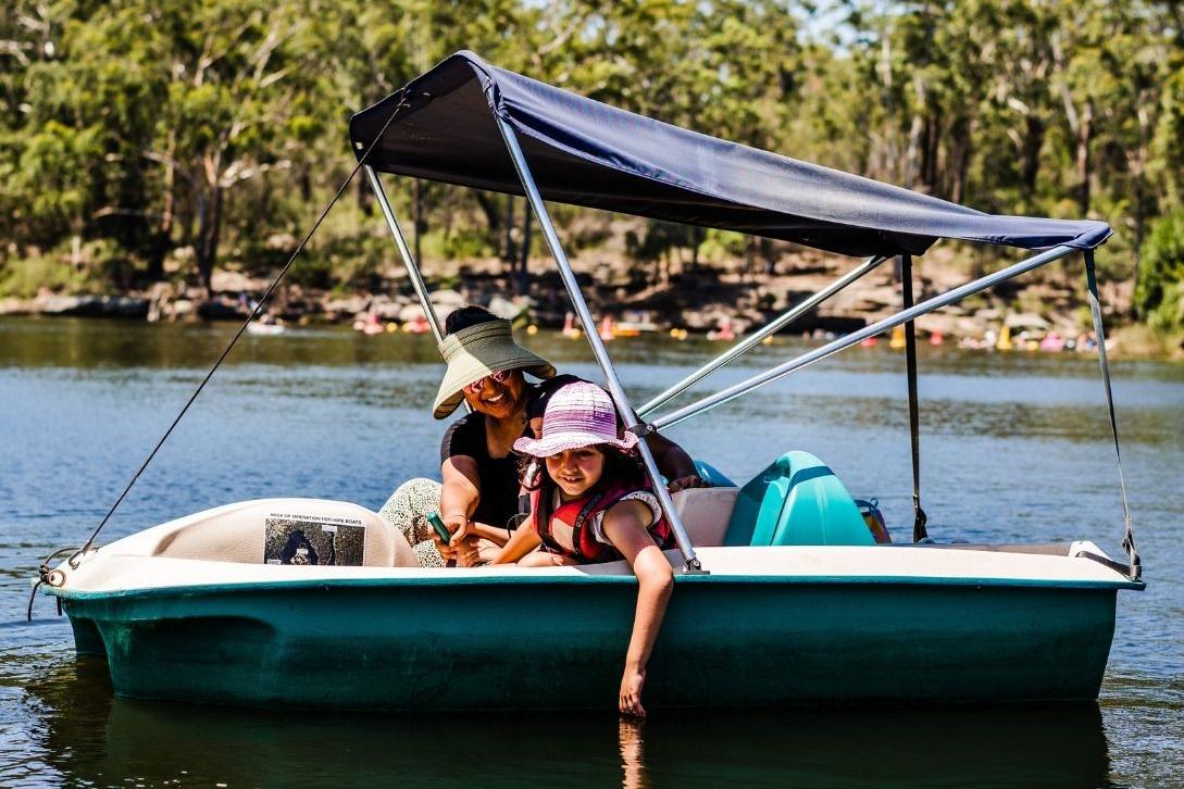 mother and daughter on pedal boat