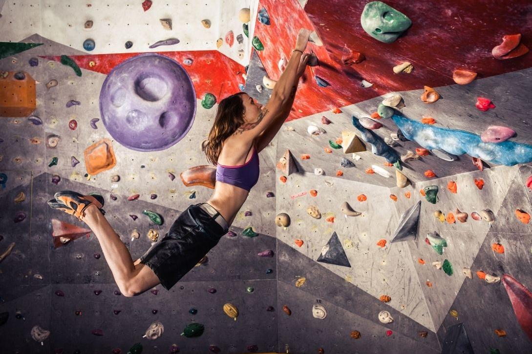 woman practicing bouldering