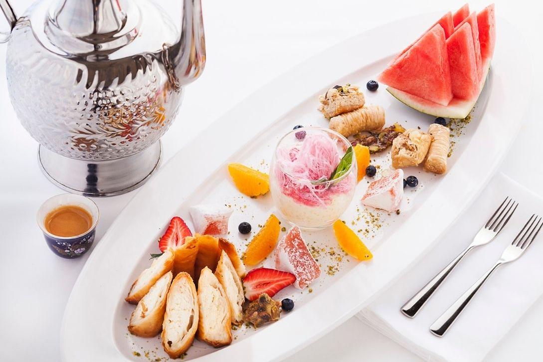 lebanese food on a white plate with white tablecloth