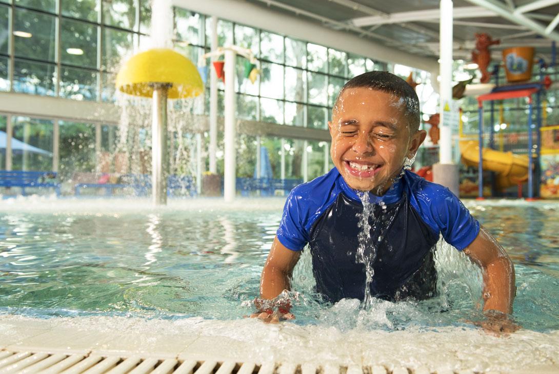 kid playing in splashers playground