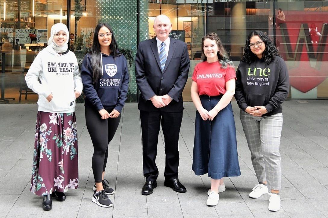 lord mayor standing with university students outside WSU campus building