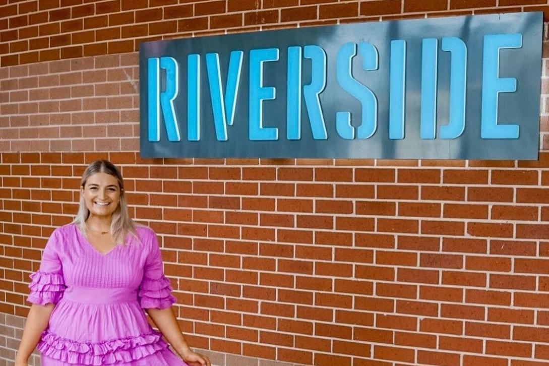 woman standing outside riverside theatres