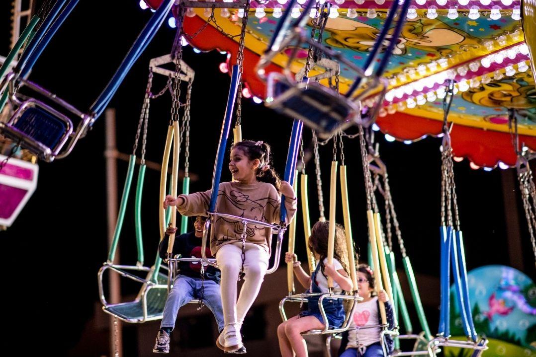 child on ride at the christmas fair