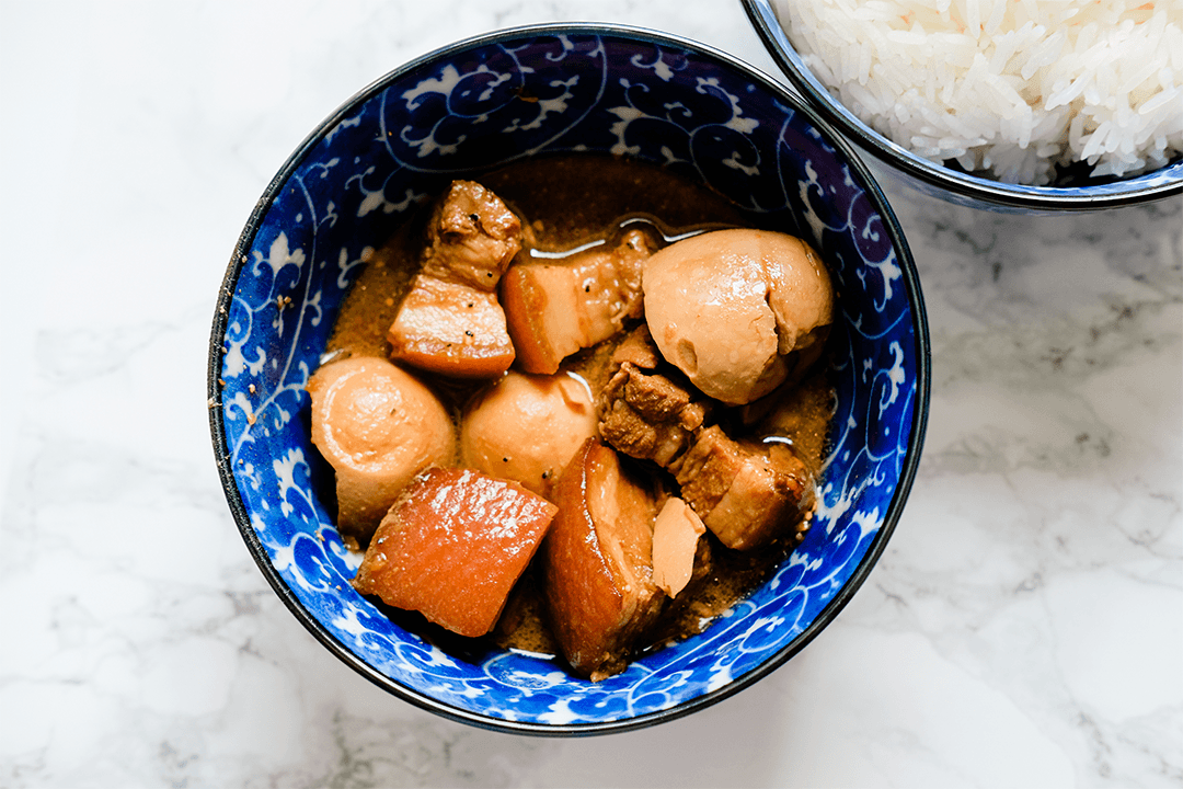 Caramelised pork belly with eggs dish