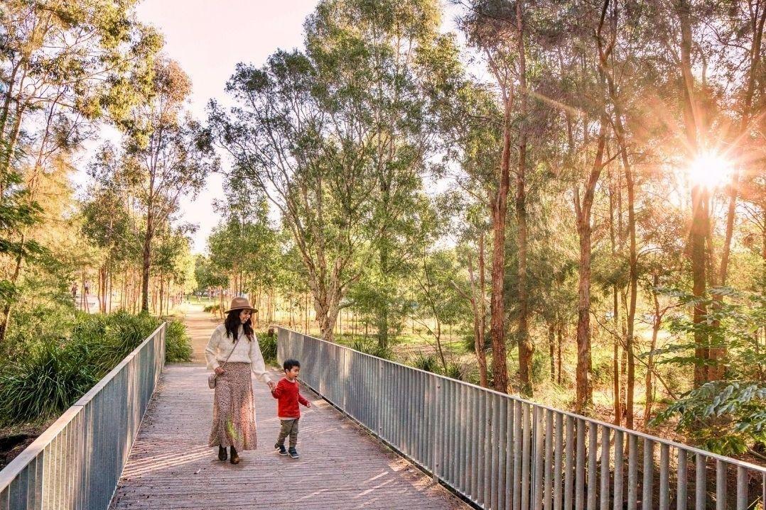 mother and son walking in Parramatta Park
