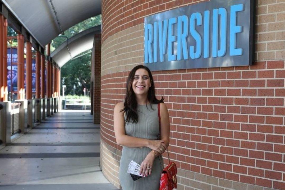 A woman standing in front of Riverside Theatres.