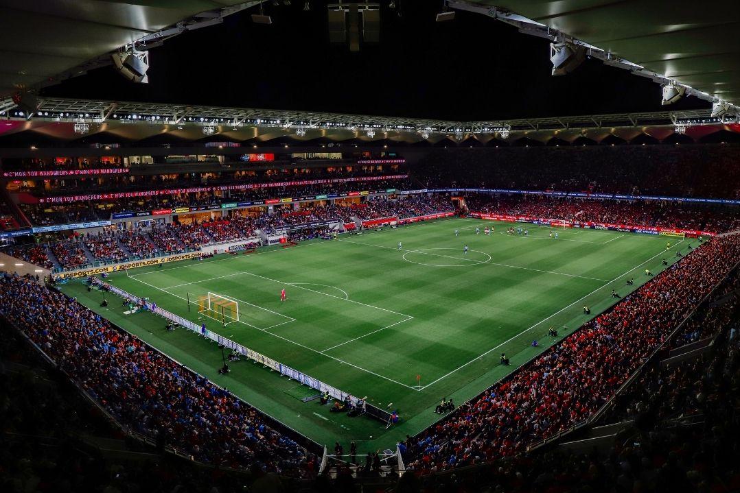 A crowd watching a soccer game at Commbank Stadium.