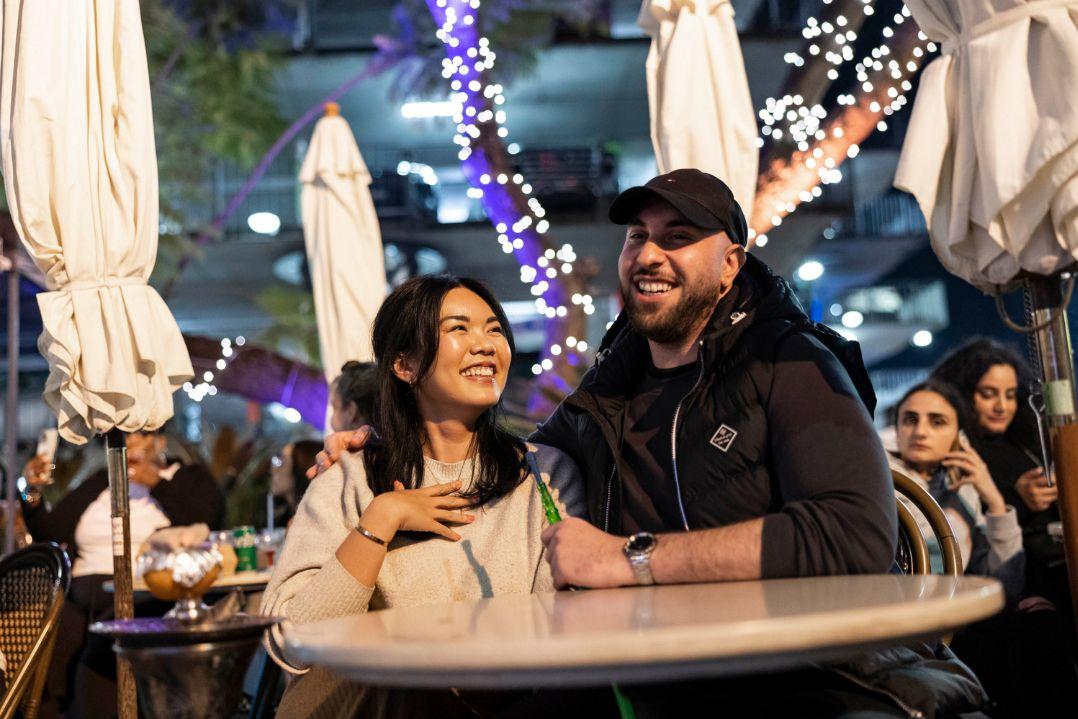 two people sitting at a table at parramatta lanes