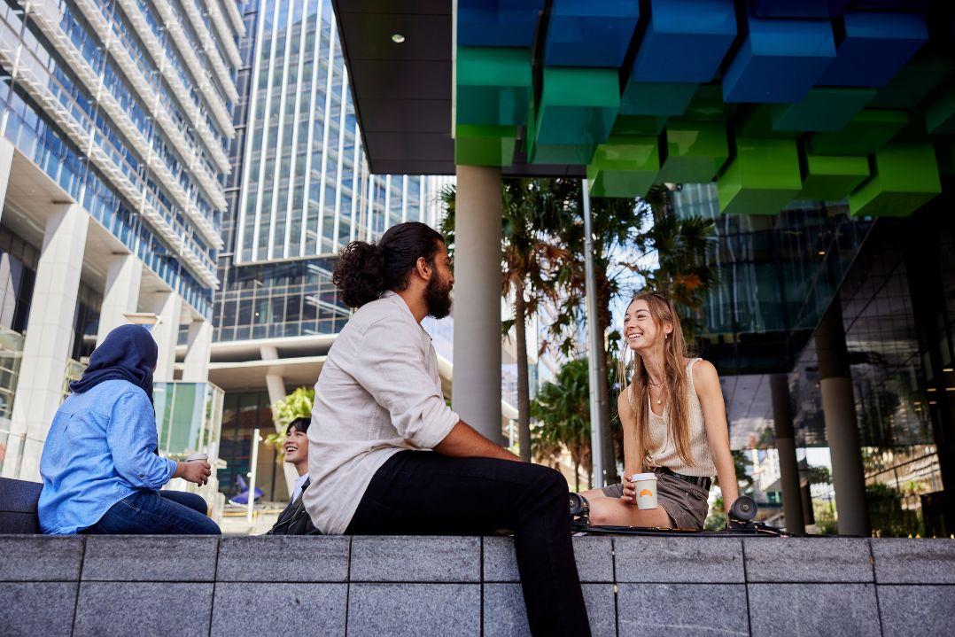 two students talking to each other