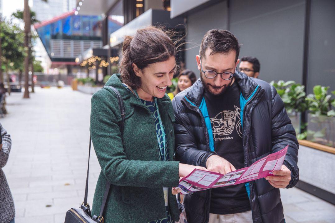 Two people looking at a brochure