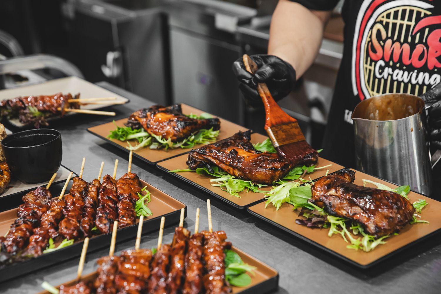 Skewers and ribs being plated up