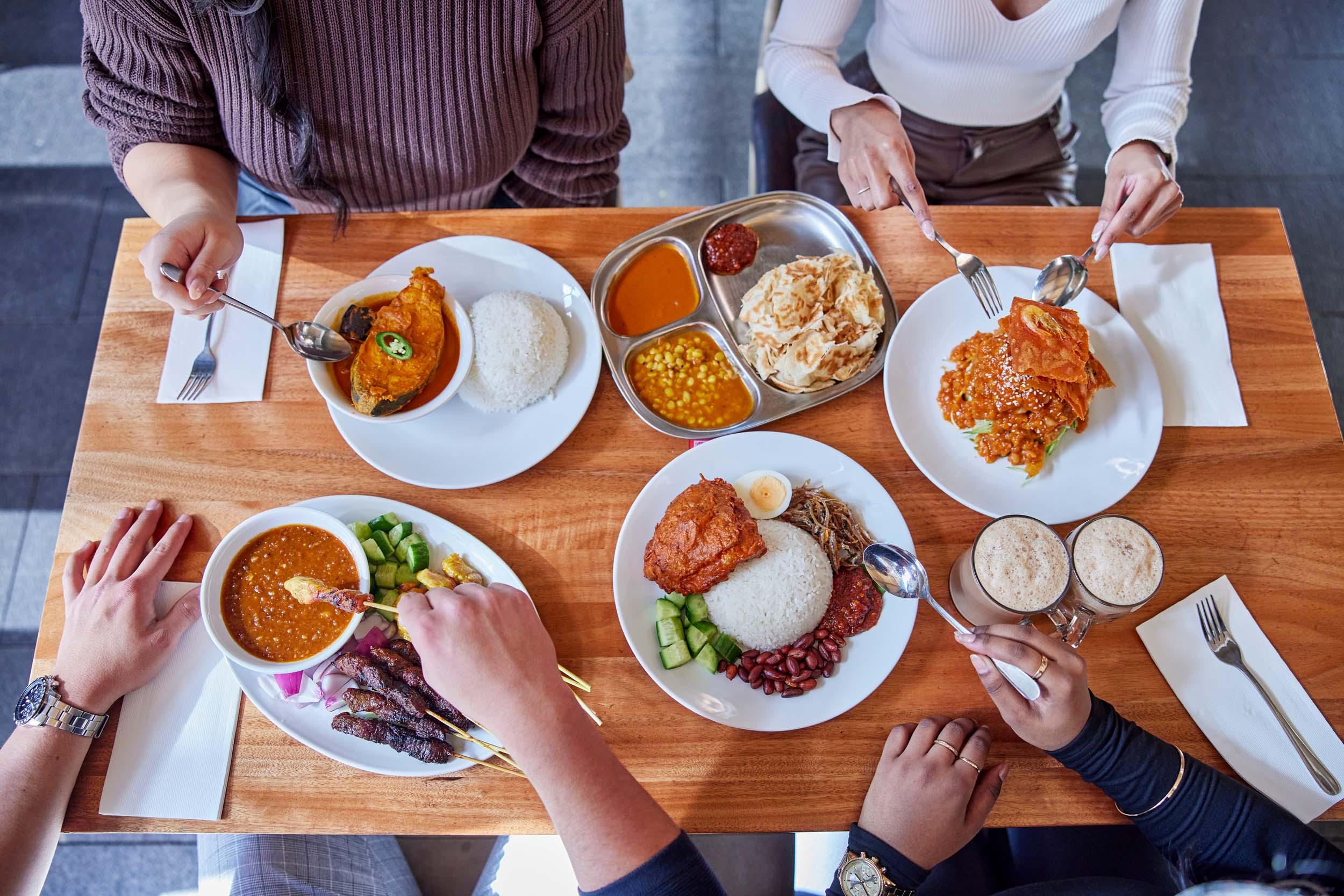 birds eye view of roti and curry dishes 